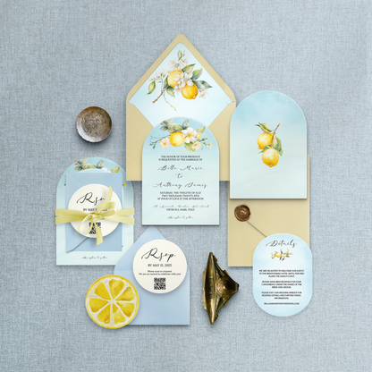 Invitation set with lemon-themed design on a gray fabric background