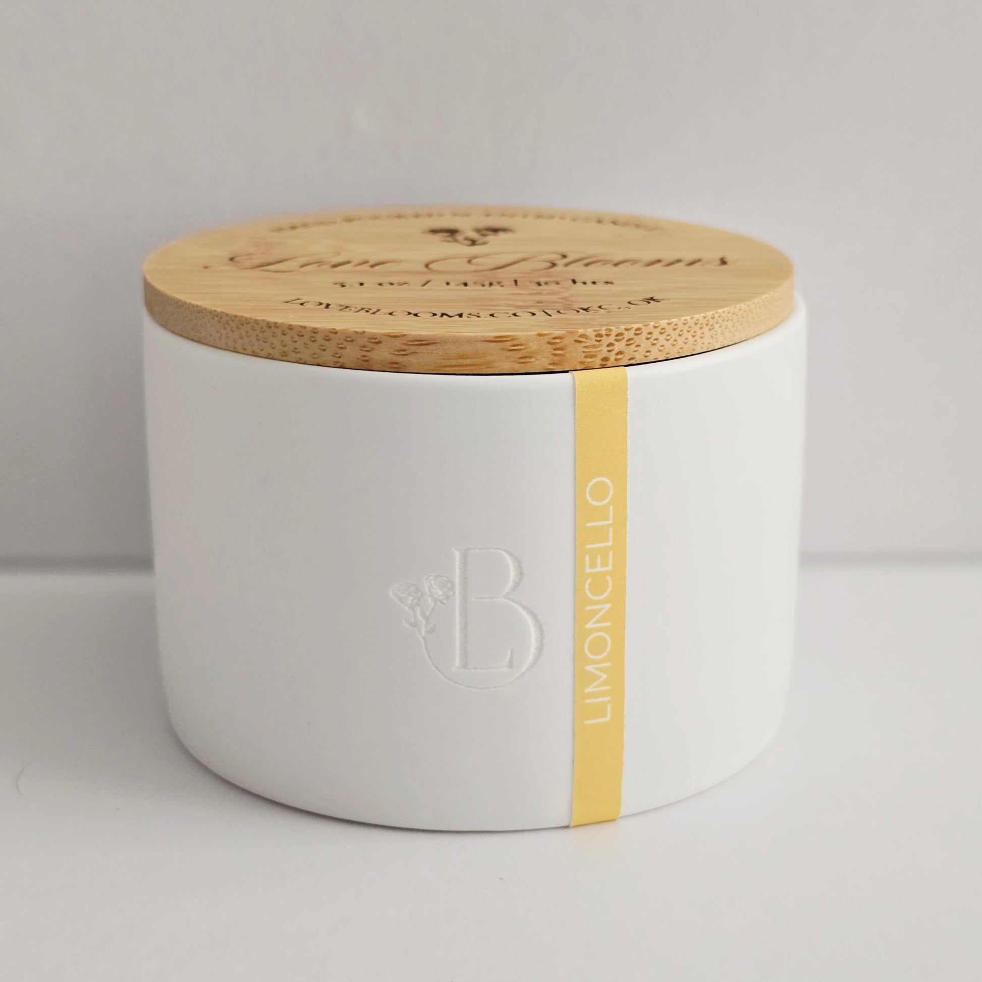 White container with wooden lid featuring branding on a light gray background