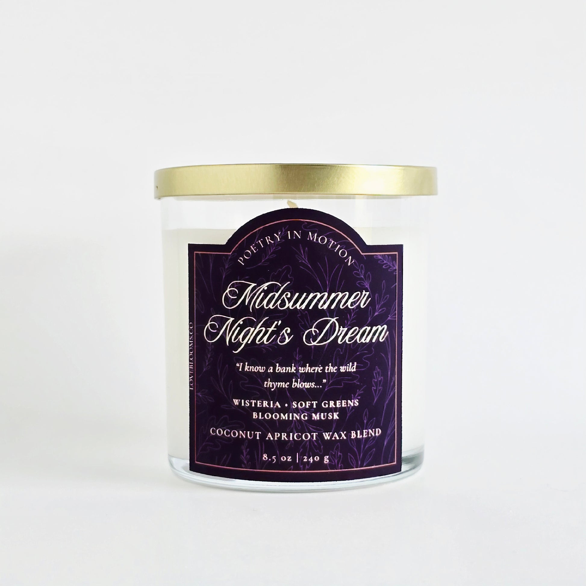 Midsummer Night's Dream Scented Candle candle with gold lid and purple label