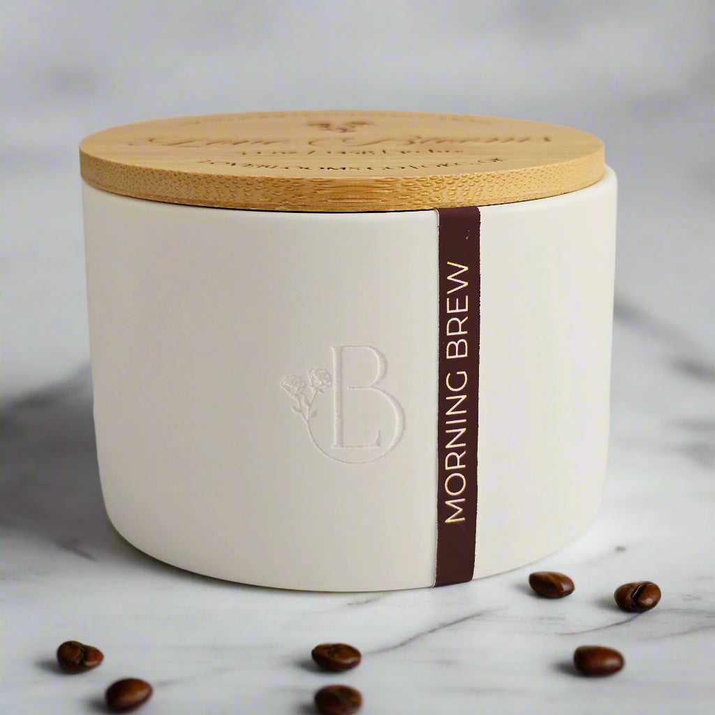White container with wooden lid and 'Morning Brew' branding on a light background