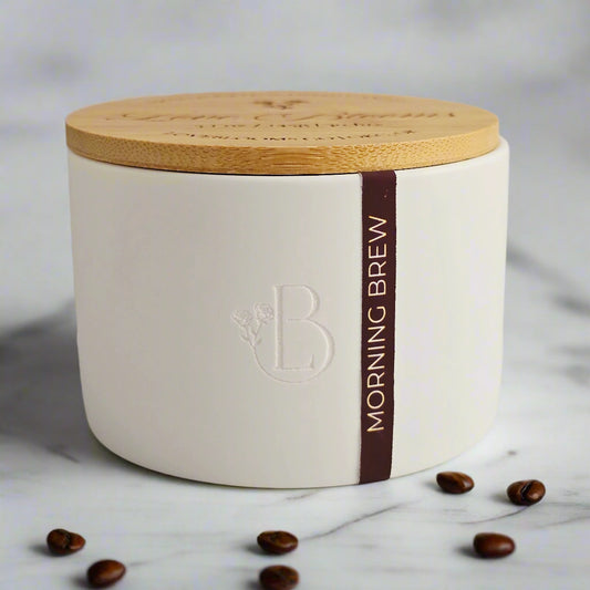 White container with wooden lid and 'Morning Brew' branding on a light background