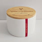 White container with a wooden lid featuring 'Love Blooms' branding on a light gray background.