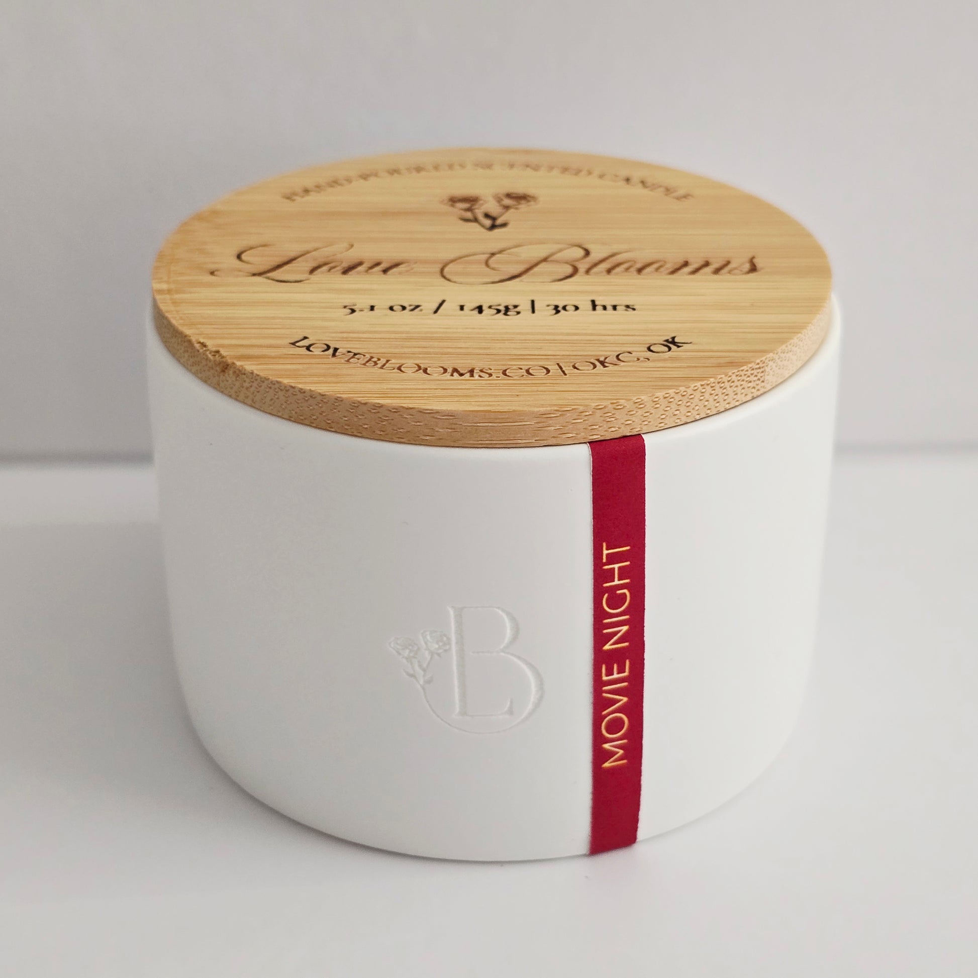 White container with a wooden lid featuring 'Love Blooms' branding on a light gray background.