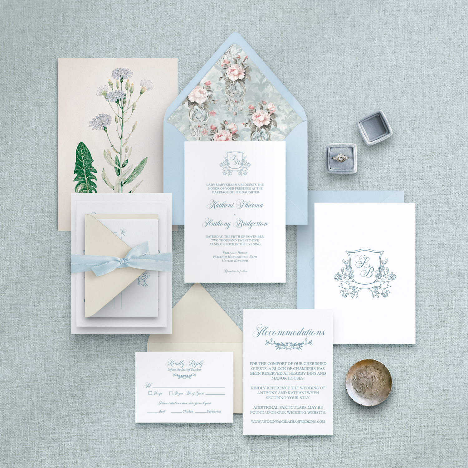 Wedding invitation set with floral design on a textured surface