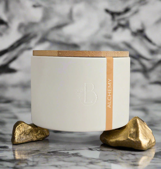 White container with a wooden lid on a light gray background